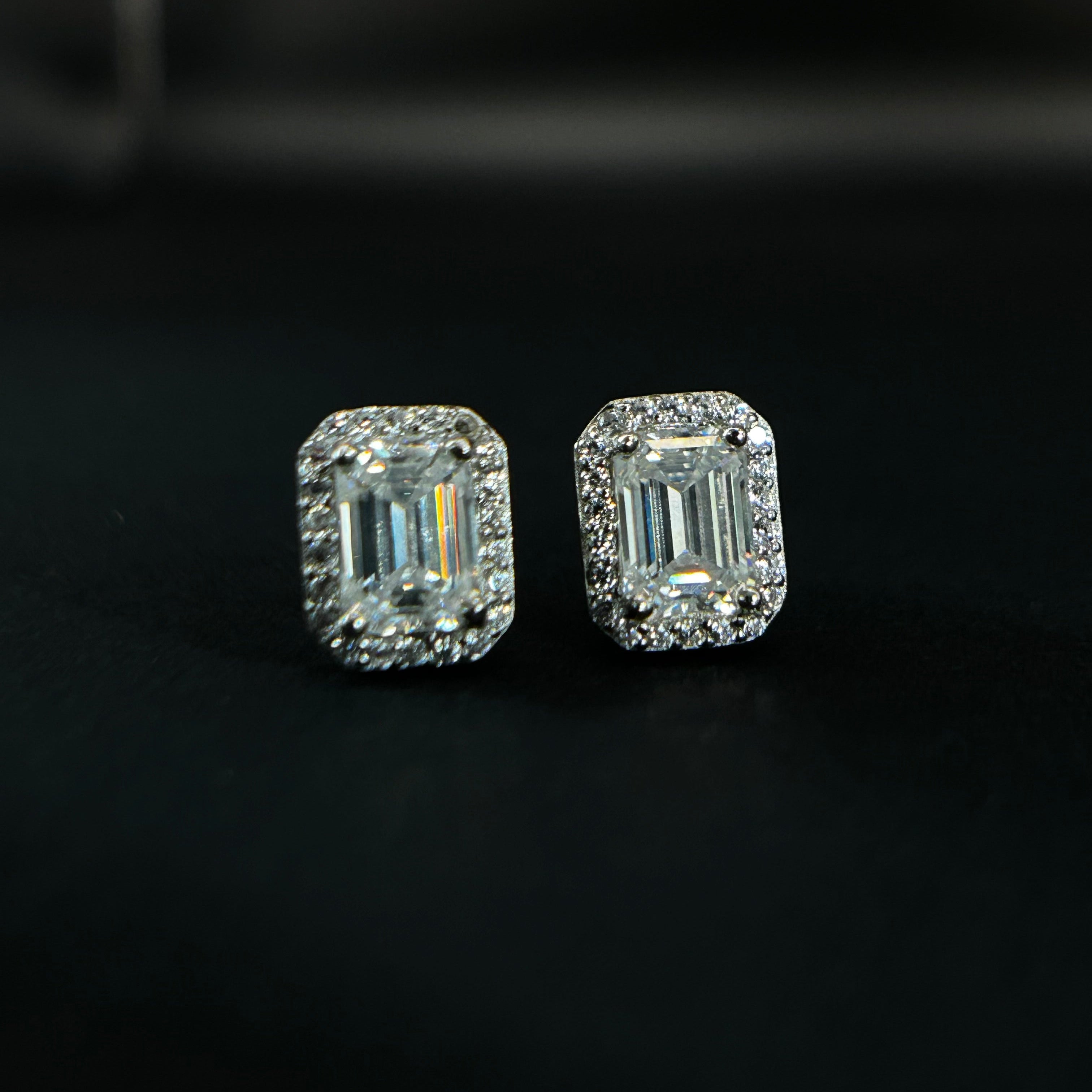 Pair of diamond earrings on a black background