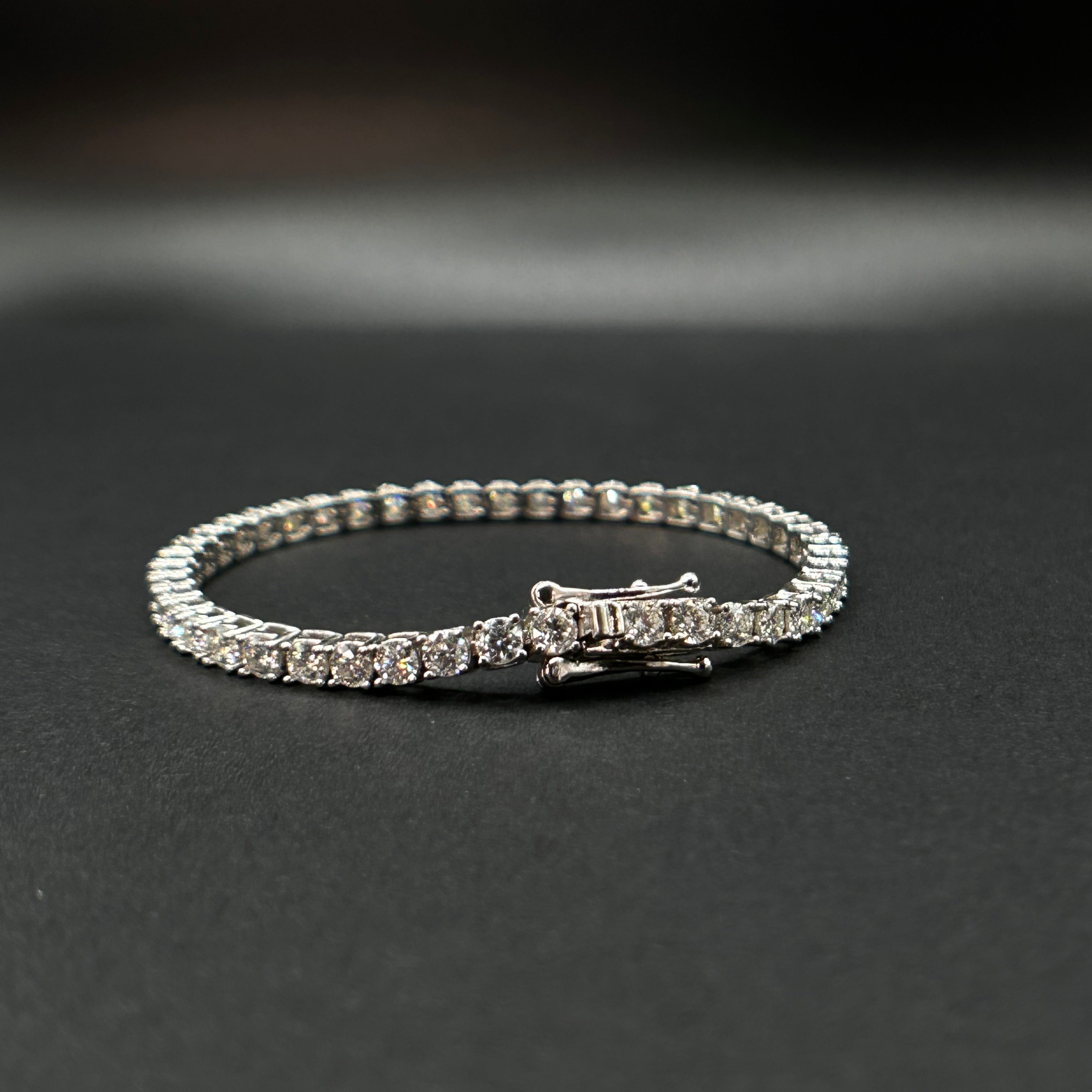 Moissasnite Diamond tennis bracelet on a black background